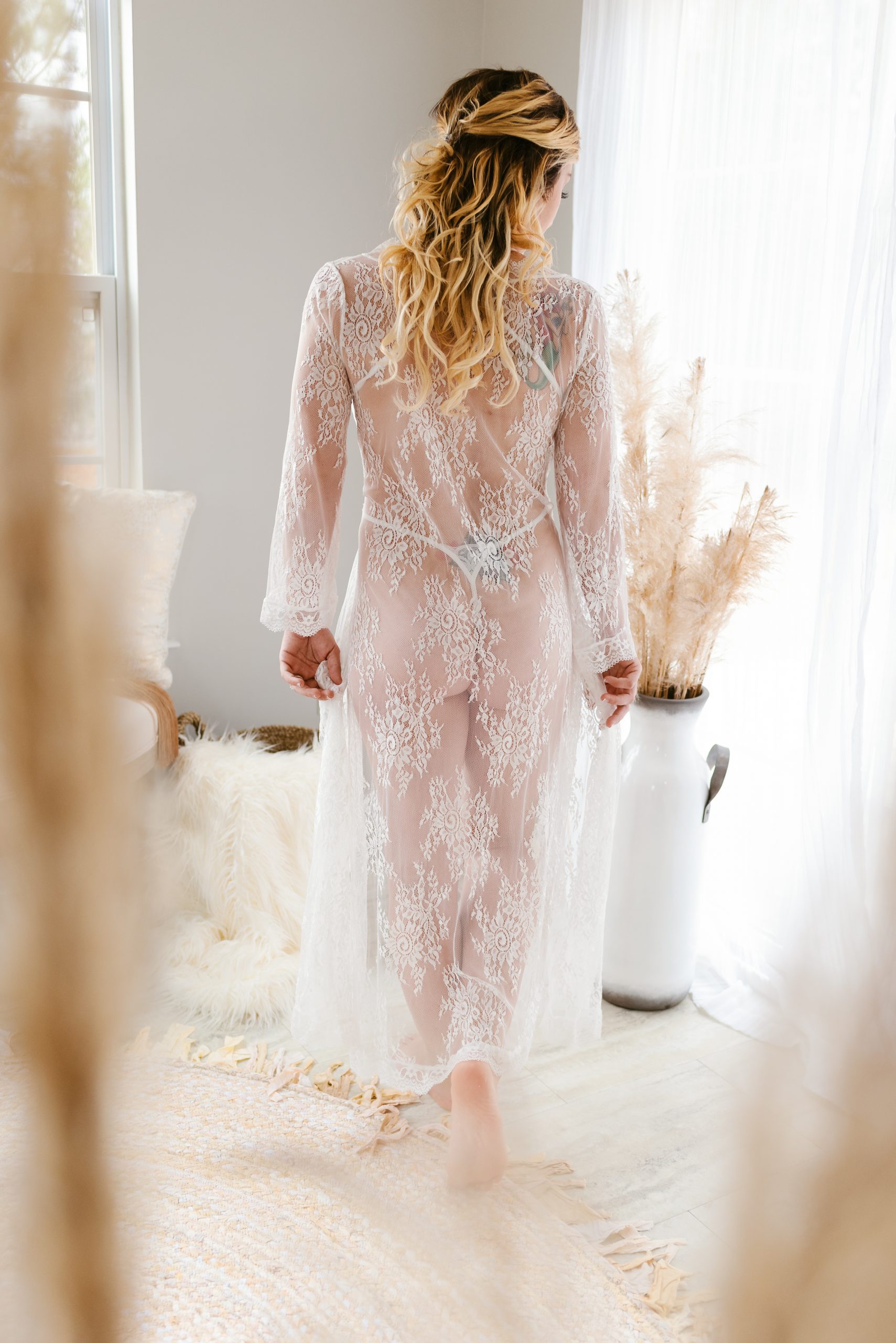 woman walking away in bridal lingerie